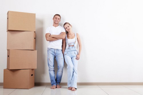 Removal team handling boxes safely during a van move
