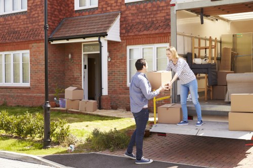 Trained removal staff handling furniture safely in Streatham