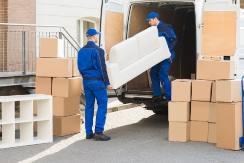Local removals team moving bulky furniture in Streatham