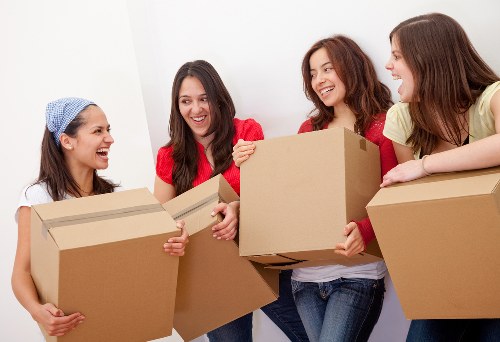 Loading household furniture into a van for a Streatham relocation