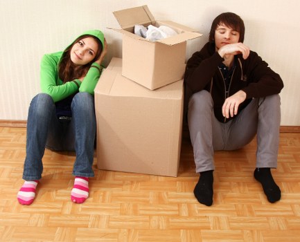 Packed moving boxes and furniture ready for transport in Streatham