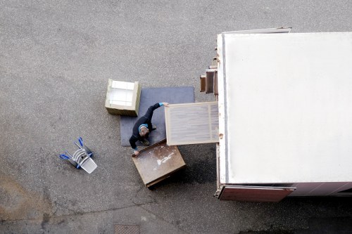 Professional movers carrying furniture during a house move