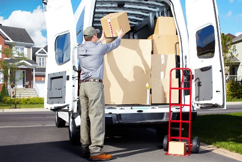 Packed moving boxes and furniture prepared for Streatham relocation