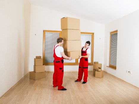 A Streatham moving service loading boxes into a van