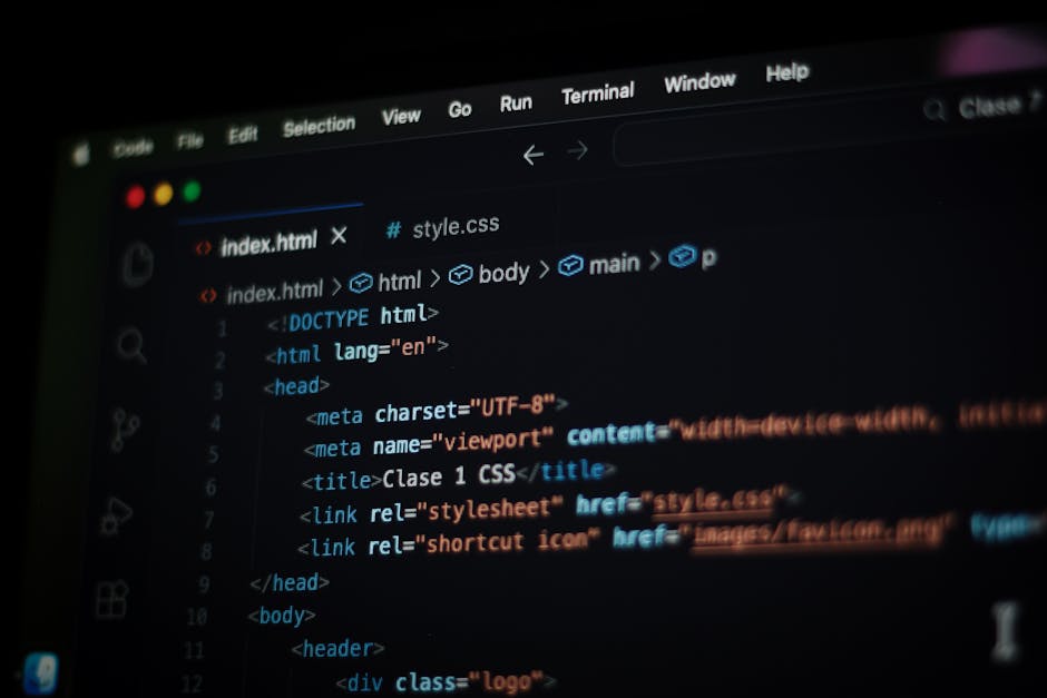 A close-up view of a laptop computer displaying lines of programming code on its screen, placed on a wooden desk next to a ceramic coffee mug with the words 'This Coffee Is Making Me Awesome' printed